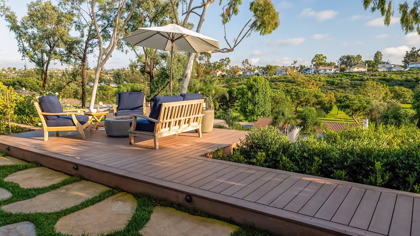 A multi-zone deck with separate dining and lounge areas