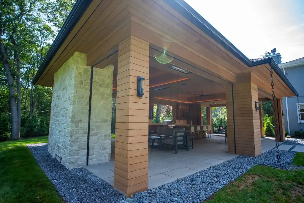 Modern Mill ACRE composite soffit on covered outdoor living pavilion with stone columns