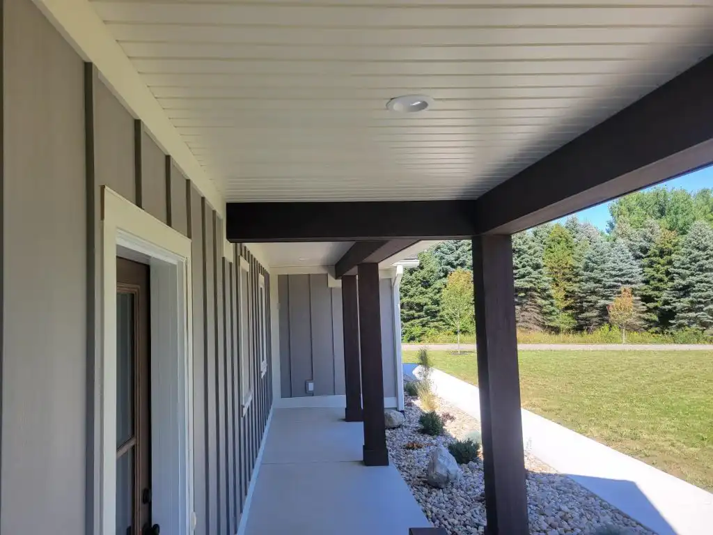 Modern Mill ACRE composite shiplap soffit on covered porch entry with white painted finish