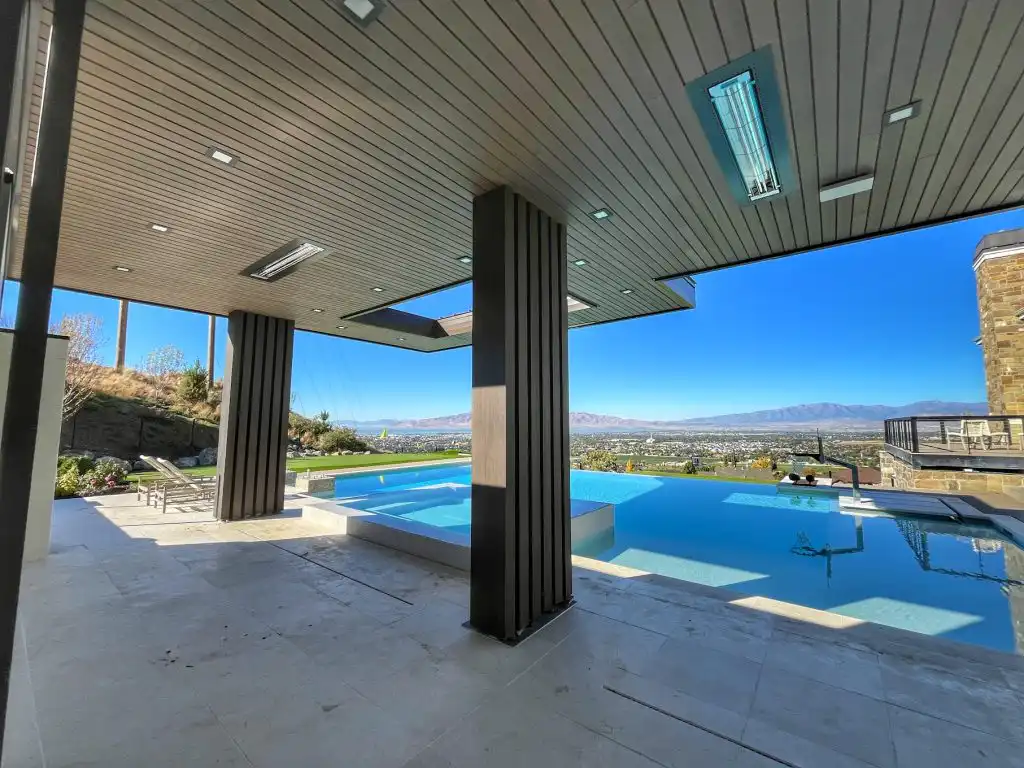 Modern Mill ACRE composite nickel gap soffit on covered pool pavilion with mountain views